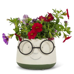 Abbott Collection close-up of metal glasses and smiling face highlighting craft and playful detail