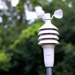 AcuRite outdoor sensor mounted on pole demonstrating weather exposure durability