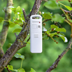 AcuRite next to a ruler to show compact size and easy placement