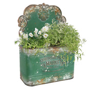 All Chic front view of green metal wall planter showing vintage charm and curb appeal