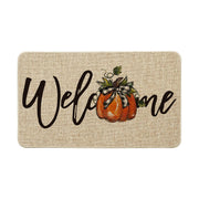 Artoid Mode front view of pumpkin bow-tie doormat showing welcome print and seasonal charm