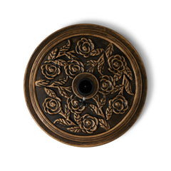 Backyard Expressions close-up of rose medallion highlighting decorative detail and durable resin