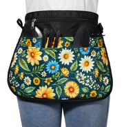 Bafelia apron front view showing green flowers pattern and pockets, neat storage