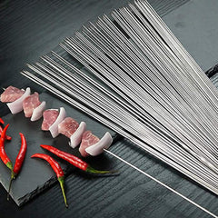 BIGOTTERS skewers lined on a grill holding kebabs for even cooking benefit