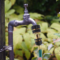 Biswing connector attached to garden hose demonstrating quick swap benefit