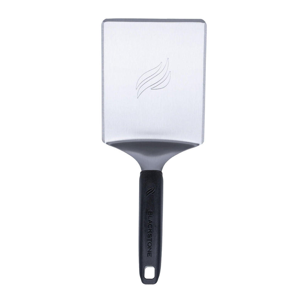 Blackstone stainless steel spatula front view showing durable wide blade and handle benefit: reliable flipping