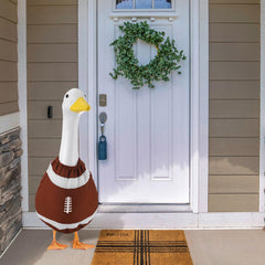 Booson side profile of dressed goose on porch demonstrating festive look