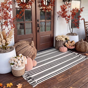 Breling front view of black and white striped porch rug shows clean entry styling and durable weave