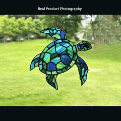 BXLZ sea turtle hanging in window capturing sunlight and color