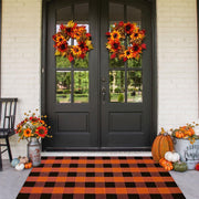 CAINANEL front view orange buffalo plaid rug elevates porch curb appeal