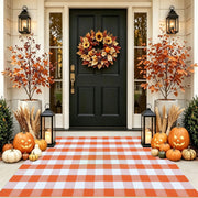 CAINANEL front view of orange buffalo plaid rug showing welcoming curb appeal