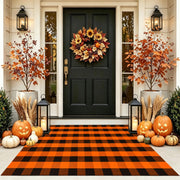 CAINANEL front view of orange buffalo plaid rug adds seasonal curb appeal