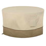 Classic Accessories front view of cover protecting round fire pit table, showing full protection