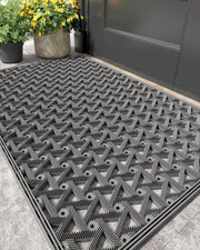 Color&Geometry front view of 24x36 grey doormat showing size and welcome look