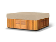 Covermates front view showing tan cover protecting square hot tub, durable protection