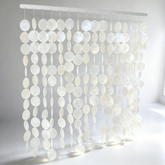 DHHOUSE front view of capiz shell wall hanging highlighting elegant coastal focal point