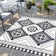 DiiKoo front view of 5x8ft rug showing boho black and white pattern and weatherproof finish