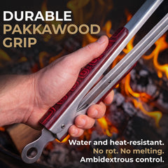 Falkridge tongs flipping steak on a grill for safer handling