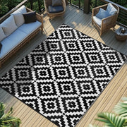 Favoyard front view of black and white outdoor rug showing pattern and benefit of style