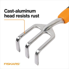 Fiskars cultivator in use loosening soil for easier planting