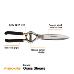 Fiskars shears in hand trimming lawn edge for accurate small-area control