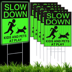 Fumete front view of six green slow down signs showing benefit of clear roadside warning