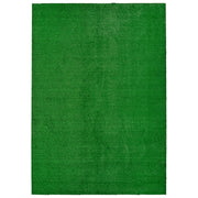 Garland Rug front view of 7x10 green artificial grass, enhances outdoor seating