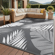 GENIMO front view of 9x12 grey white patio rug showing full palm-leaf pattern and benefit of area coverage