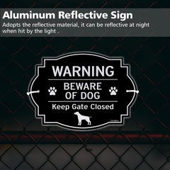 GicnKeuz sign mounted on a wooden gate demonstrating weather resistance