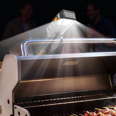Goldusk front view mounted on grill handle showing secure fit and bright lighting