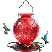 Grete Gotye front view feeder showing red ports and clear glass, attracts hummingbirds
