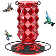 Grete Gotye front view red glass feeder attracting birds and enhancing garden decor