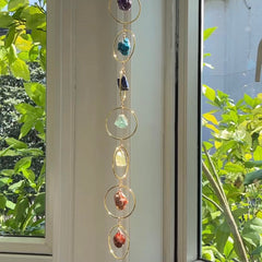 HausArtX hanging by window with sunlight showing movement and ambient glow