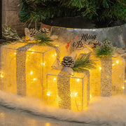 Hourleey front view of three lit gift boxes enhancing holiday entryway