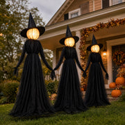 Hourleey witches front view showing three illuminated figures and curb appeal