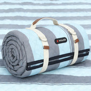 HX&OD front view of folded blanket with carry strap showing portability