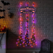 Iheqard front view of broom parking sign showing whimsical text and clear hanging holes
