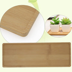 Joyangy bamboo tray next to planter showing scale and fit for narrow pots
