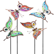 Juegoal front view of four butterfly stakes adding color to a garden