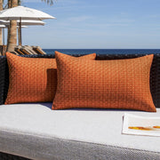 K KEVIN TEXTILE front view of burnt orange pillow cover enhances outdoor decor