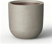 Kante front view of weathered concrete planter showing shape and balance