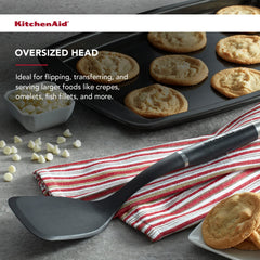 KitchenAid handle detail with stainless steel 1919 medallion and chrome bolster for durable finish