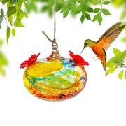KRISININE front view of glass hummingbird feeder showing colorful design and hanging hook