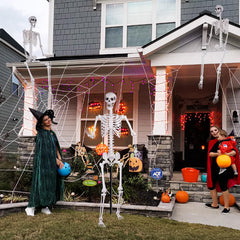 Kukooka skeleton on porch creating a spooky Halloween welcome