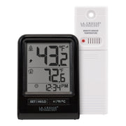 La Crosse Technology front display showing indoor and outdoor temperatures and trend arrows