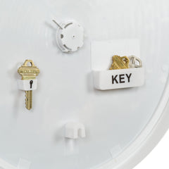 La Crosse Technology open hidden key compartment demonstrating secure spare key storage