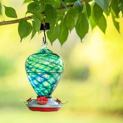 LaElvish Garden feeder in use with hummingbird demonstrating easy access and wildlife attraction