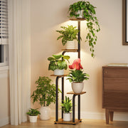 LASZOLA front view of brown tall plant stand showing space-saving benefit
