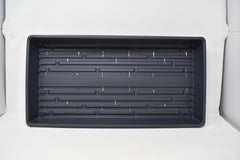 Living Whole Foods close-up of tray interior showing drain holes and sturdy plastic, prevents waterlogging