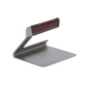 Made In front view of grill press showing compact shape and searing benefit